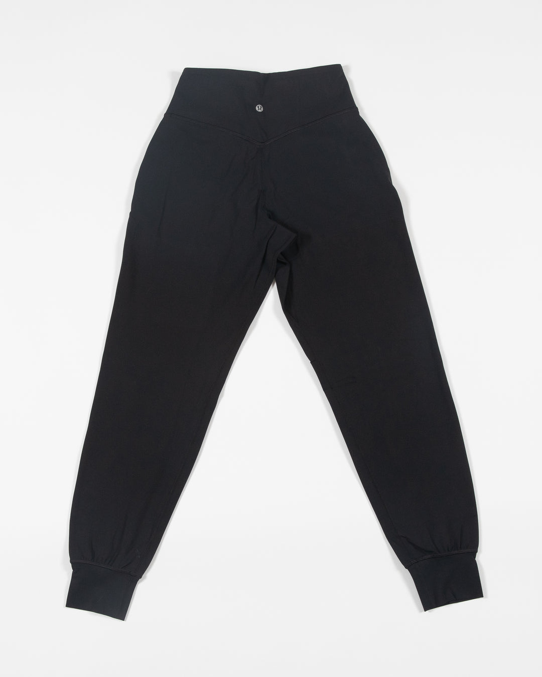 black lululemon women's jogger with full color Chicago Blackhawks primary logo on left leg - back lay flat