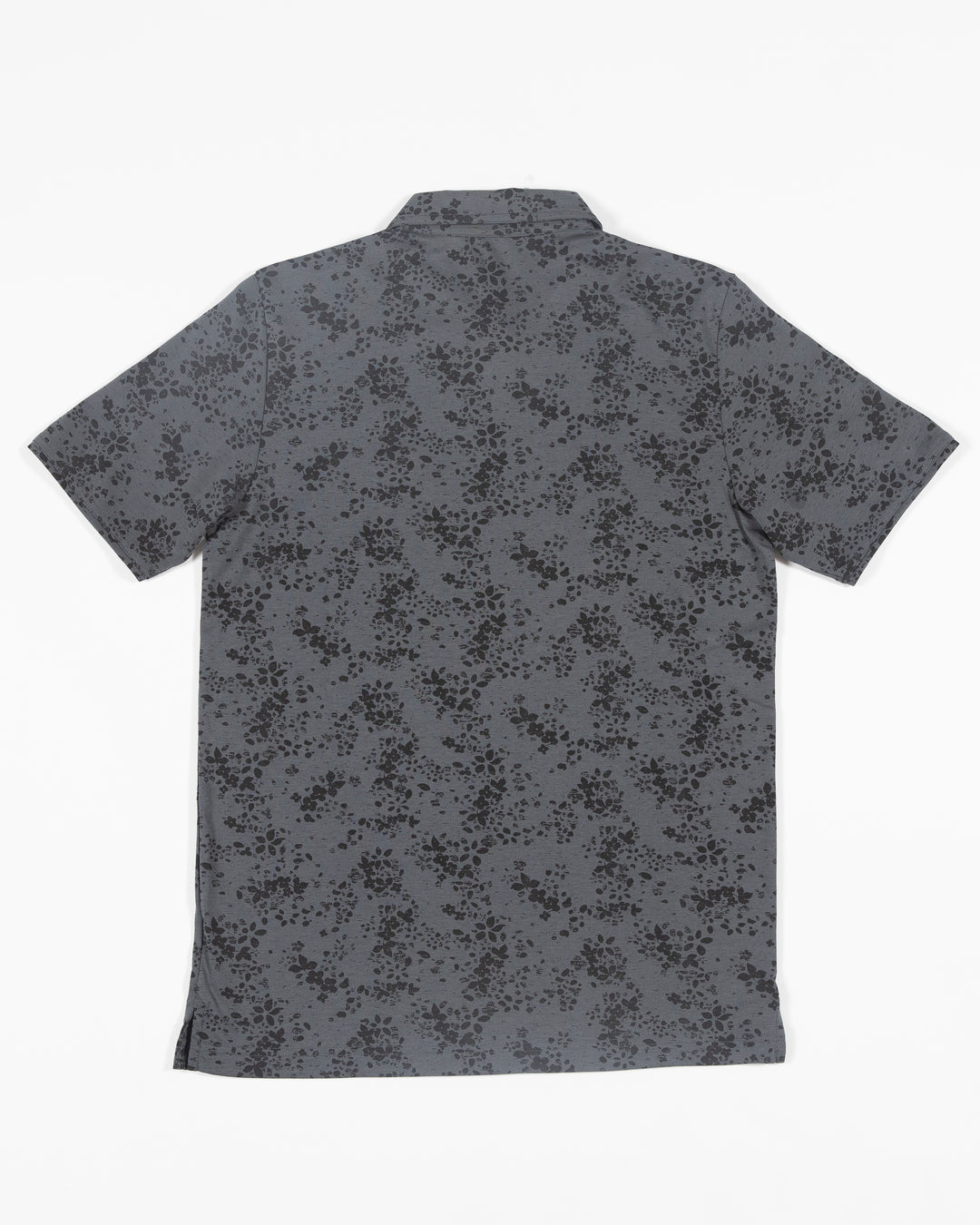 black floral print TravisMathew polo with embroidered Chicago Blackhawks primary logo embroidered on left chest - back lay flat
